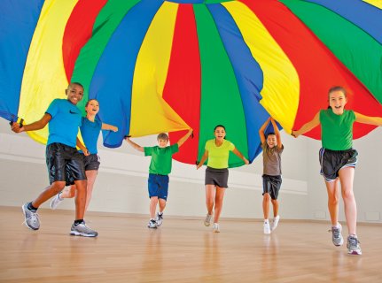 Group of children playing with a parachute
